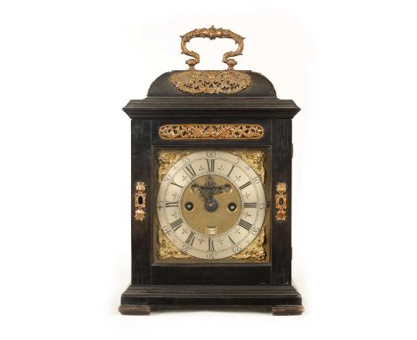 JOHN PEPYS, LONDON. A SMALL WILLIAM AND MARY EBONY VENEERED BRACKET CLOCK the caddy top case with well cast applied pierced m