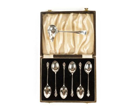 A CASED SET OF SIX ELIZABETH II SILVER TEASPOONS of plain design with decorative handles Birmingham 1952 together with A GEOR