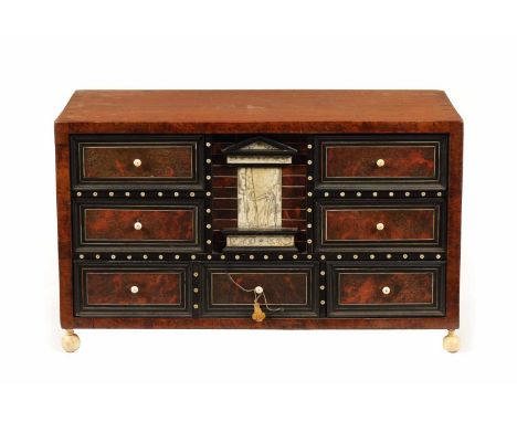 A 17TH CENTURY ITALIAN WALNUT TORTOISESHELL, EBONY AND IVORY DECORATED TABLE CABINET the sides with quarter matched veneers f