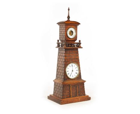 AN EDWARDIAN OAK DESK COMPENDIUM FORMED AS A LIGHTHOUSE the tapering case with carved simulated brickwork and gallery top enc