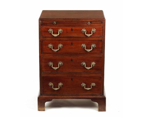 AN UNUSUALLY SMALL GEORGE II MINIATURE MAHOGANY CHEST OF DRAWERS the D moulded edge top above a brushing slide and four long 