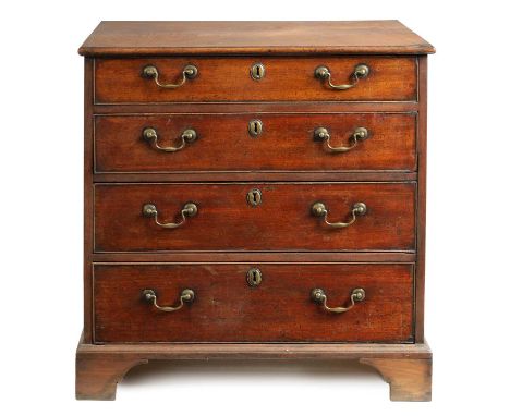 A GEORGE III MAHOGANY CHEST OF SMALL SIZE of four graduated drawers fitted with brass swan-neck handles; raised on shaped bra