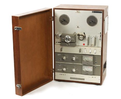 A RARE VINTAGE AKAI SOLID-STATE MODEL M-9 REEL-TO-REEL TAPE PLAYER with cover52cmw high 34cm wide 19cm deep