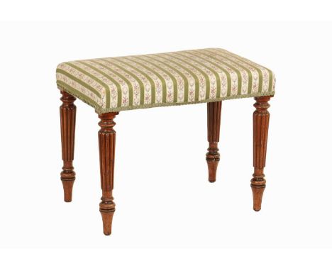AN EARLY 19TH CENTURY MAHOGANY UPHOLSTERED STOOL IN THE MANNER OF GILLOWS with ring turned reeded tapering legs.58cm wide 37c