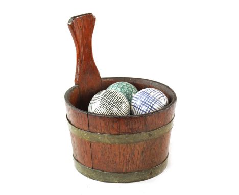 A 19TH CENTURY SET OF CERAMIC CARPET BOWLS decorated in coloured enamels; with oak brass bound carrying bucket22cm diameter 2