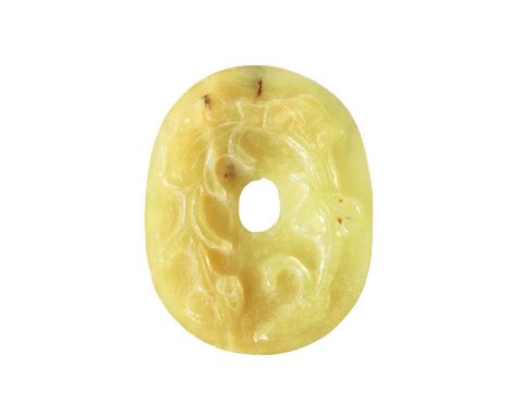 A CHINESE CARVED JADE PENDANT of oval form with relief carved leafwork decoration, engraved decoration to the reverse 7cm hig