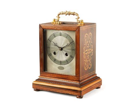 A MID 19TH CENTURY FRENCH INLAID ROSEWOOD MANTEL CLOCK surmounted with a gilt hinged handle above a rectangular case with box