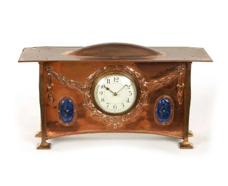 ATT. GEORGE WALTON. A COPPER AND ENAMEL ARTS AND CRAFTS MANTEL CLOCK the riveted top with domed centre above an enamel Arabic