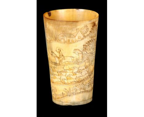 A GEORGIAN CARVED HORN BEAKER WITH HUNTING SCENE depicting riders on horseback with hounds at foot 14cm high 8.5cm diameter.