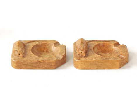 TWO ROBERT 'MOUSEMAN' THOMPSON LIGHTLY ADZED LIGHT OAK ASH TRAYS with dished centres and raised carved mouse trademarks. (2)1