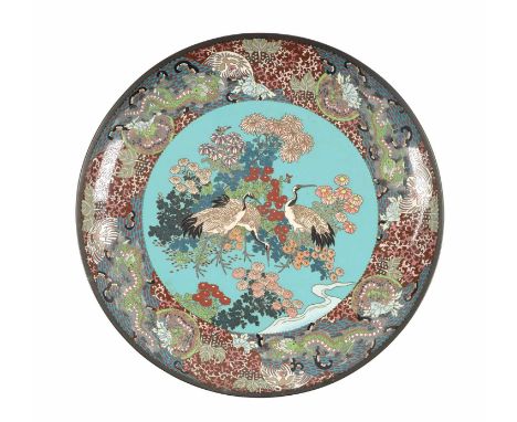 A LARGE JAPANESE MEIJI PERIOD CLOISONNÉ ENAMEL CHARGER with brightly coloured decoration depicting storks and flowering trees