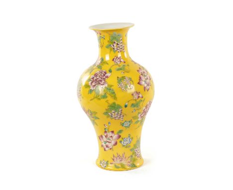 A CHINESE FAMILLE ROSE YELLOW GROUND VASE of inverted baluster form with floral decoration and blue six-character seal mark t