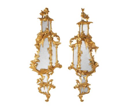 A PAIR OF LATE GEORGE III 'CHINESE CHIPPENDALE' GILT GESSO SIDE MIRRORS of elaborate Rococo design with leaf-scrolled borders