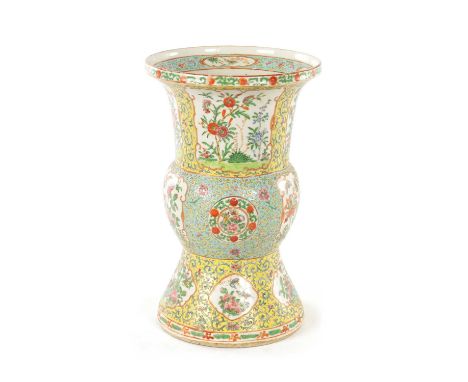 A CHINESE QING DYNASTY YELLOW GROUND FAMILLE ROSE VASE with tapered foot and neck enclosing a rounded centre, decorated bird 