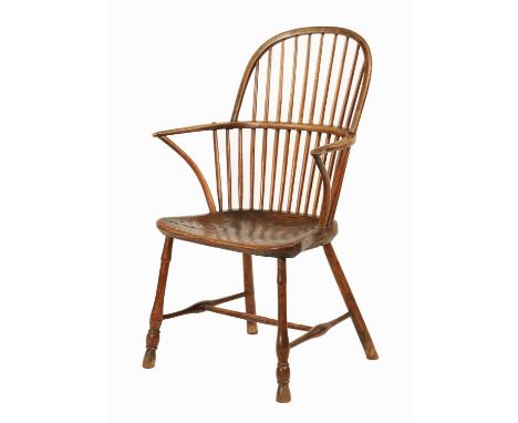 AN EARLY 19TH CENTURY ELM STICK BACK WINDSOR CHAIR the hooped back and splayed arms with spindle supports and crook arms abov