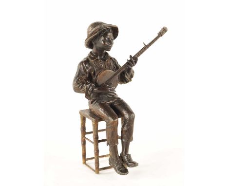 A LATE 19TH CENTURY COLD PAINTED METAL FIGURE modelled as a boy seated on a stool playing a banjo.33.5cm high 