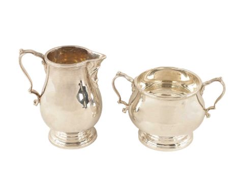 AN ELIZABETH II HEAVY GAUGE SILVER SUGAR BOWL AND MILK JUG of plain two-handled pedestal design, the milk jug of baluster for