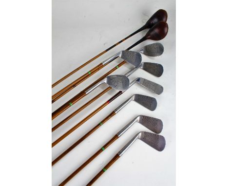 Vintage 'The Ritchie' golf bag, with various clubs to include early set of matched steel shaft irons (2-8), with driver and b