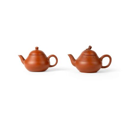  TWO YIXING STONEWARE TEAPOTS AND COVERS QING DYNASTY, JIAQING AND DAOGUANG MARK, 19TH CENTURY 清 嘉慶款及年代 宜興朱泥素面梨形小茶壺 及 道光款及年代 