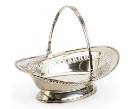Victorian silver oval fruit dish with pierced decoration and swing handle on short pedestal foot W28cm Sheffield 1885 Maker H