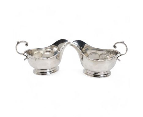 Pair of silver panel sided sauce boats with leaf capped C scroll handles Birmingham 1935 Maker Adie BrothersCondition Report: