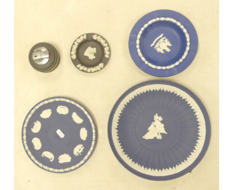 Wedgwood, Five items of Jasperware to include three Dark Blue plates / ashtray, black small ashtray (a/f) and a small gilt ta