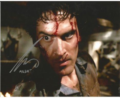 Bruce Campbell The Evil Dead hand signed 10x8 photo. This beautiful hand signed photo depicts Bruce Campbell as Ash in the hi