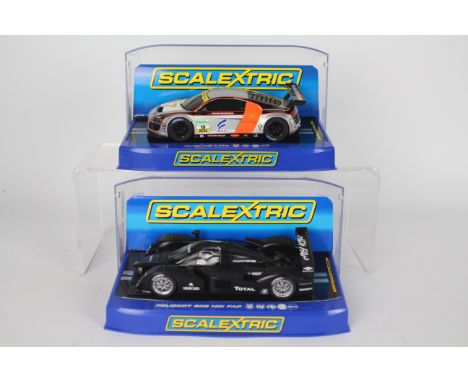 Scalextric - Two boxed Scalextric 1:32 scale slot cars. Lot consists of C2898 Peugeot 908 HDi FAP 2007 Test Car; together wit