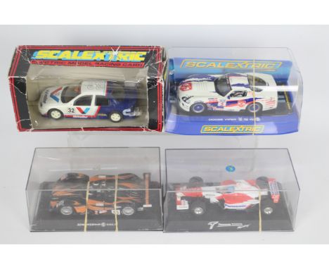 Scalextric - 4 boxed cars, # C2044 Ford Mondeo, # C2907 Dodge Viper, MG Lola and a Panasonic Toyota. The models show signs of