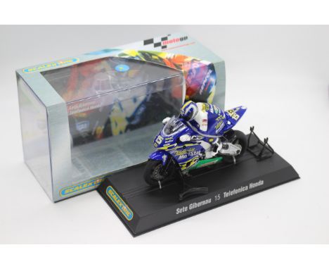 Scalextric - A boxed 2004 Moto GP Telefonica Honda ridden by Sete Gibernau # C6003 The model appears Mint in a Very Good pers