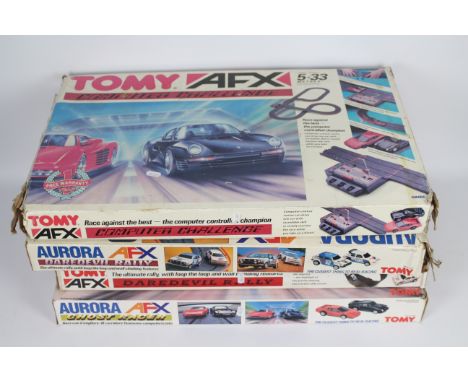 Tomy - Aurora - 4 x boxed sets of AFX Racing, # 2 x 8652 and 2 x 8653 with Ferrari, Porsche, VW and Peugeot cars. They all sh