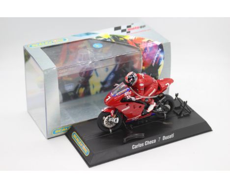 Scalextric - A boxed 2004 Moto GP Ducatti Desmosedici ridden by Carlos Checa # C6023 The model appears Mint in a Very Good pe