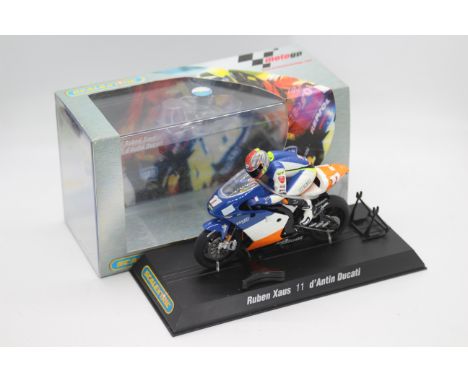Scalextric - A boxed 2004 Moto GP Ducatti Desmosedici ridden by Ruben Xaus # C6013 The model appears Mint in a Very Good pers