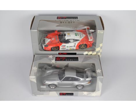 UT Models - 2 x boxed 1:18 scale Porsche models, a 911 GT2 Street car in silver # 065000 and a 911 GT1 in orange and white. T