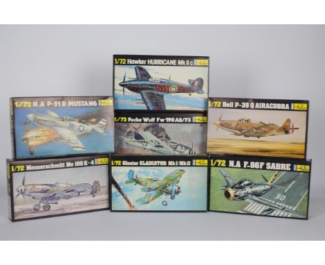 Heller - A fleet of seven boxed Heller 1:72 scale plastic military aircraft model kits. Lot includes Heller #269 Hawker Hurri