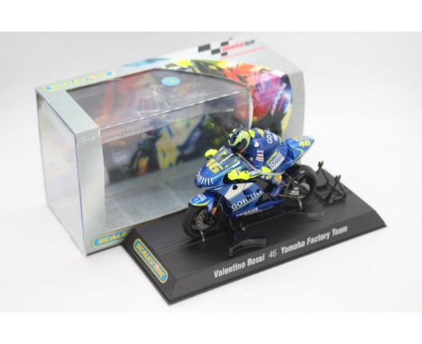 Scalextric - A boxed 2004 Moto GP Yamaha ridden by Valentino Rossi # C6020 The model appears Mint in a Very Good perspex disp