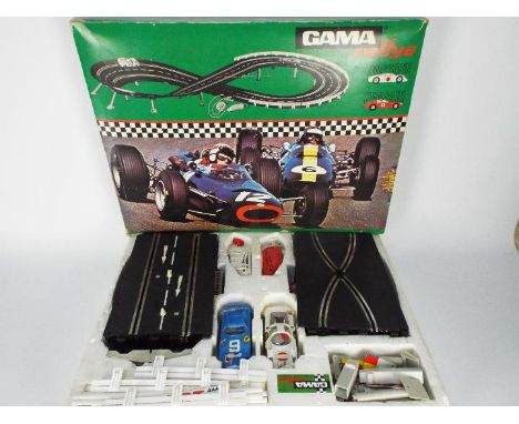 Gama Rally - A boxed vintage Gama slot car racing set in 1:32 scale # 7220. The set contains a Porsche Carrera 6 and Ferrari 