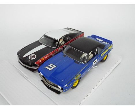 Scalextric - A pair of ex set cars, a Ford Mustang Boss number 16 car # C2402 and a Chevrolet Camaro Sunoco number 9 car. The