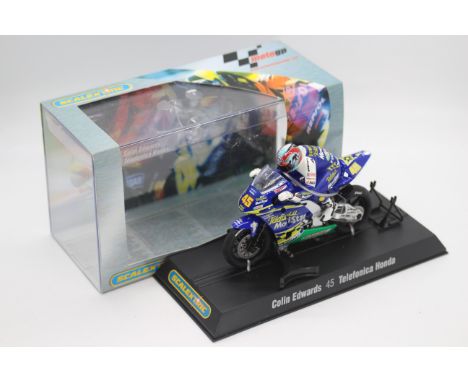 Scalextric - A boxed 2004 Moto GP Telefonica Honda ridden by Colin Edwards # C6007 The model appears Mint in a Very Good pers