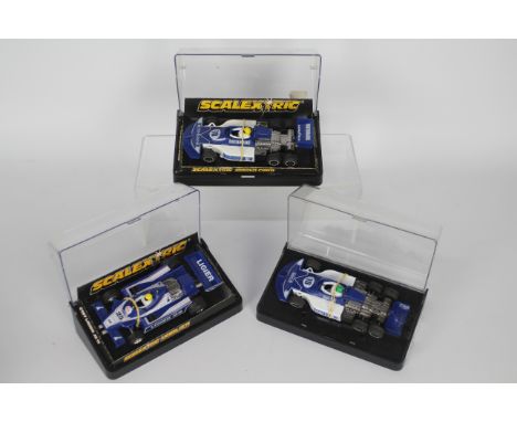 Scalextric - 3 x boxed models, two March Ford six wheel cars # C129 and a Ligier JS11 # C137. The cars appear Very Good but t