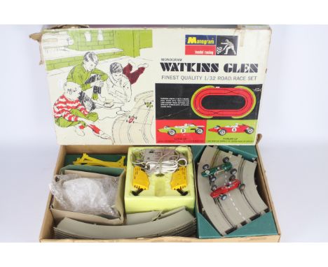 Monogram - A rare 1:32 scale Monogram Watkins Glen Road Race set with Lotus and Ferrari GP cars. The set shows signs of age a