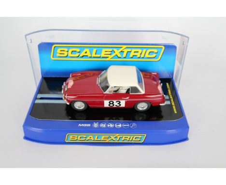 Scalextric - A boxed MGB 1964 Monte Carlo Rally GT Class Winner # C3143. The car appears Mint in a Very Good perspex display 