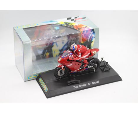 Scalextric - A boxed 2004 Moto GP Ducatti Desmosedici ridden by Troy Bayliss # C6009 The model appears Mint in a Very Good pe