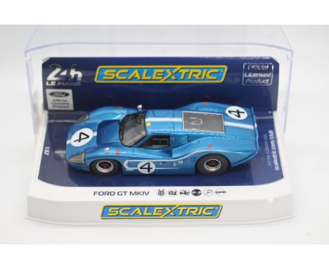 Scalextric - A boxed Scalextric C4031 Ford Gt Mk.IV 1967 Le Mans 24H 'Denny Hulme / Lloyd Ruby' RN4 1:32 scale slot car. Mode