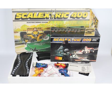 Scalextric - 2 x vintage boxed sets, # C559 Scalextric 200, # C634 Scalextric 400. Both sets show signs of age and use and ar