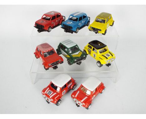 Scalextric - A collection of 8 x Mini models including three Mini Coopers and five Mini Clubman models. They show light signs