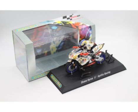 Scalextric - A boxed 2004 Moto GP Aprillia ridden by Shane Byrne # C6010 The model appears Mint in a Very Good perspex displa