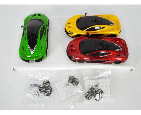 Scalextric - 3 x ex set McLaren P1 cars. The models all appear Near Mint with some very light storage marks. (This does not c