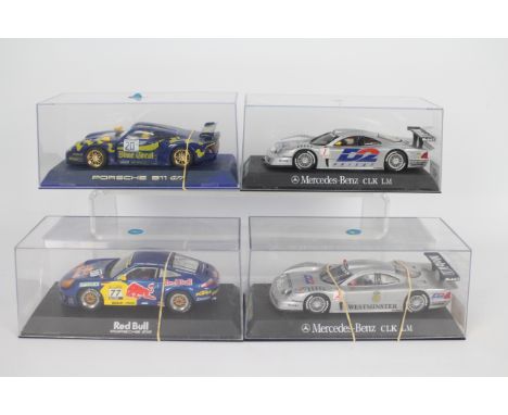 Scalextric - 4 x boxed cars, 2 x Mercedes Benz CLK LM, a Porsche 911 GT3R and a Porsche 911 GT1. All the models show signs of