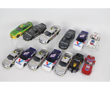 Scalextric - 13 x unboxed 1:32 scale slot car models including three Chevrolet Corvette models, seven Ford Taurus Nascar mode